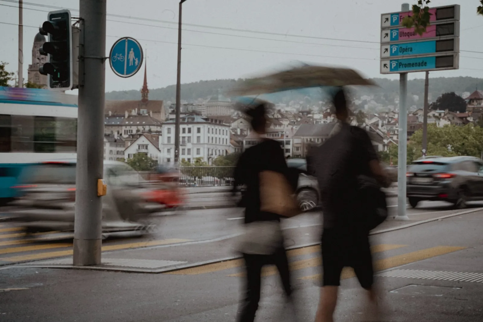 Pedestrians blurred crossing a street in Zurich